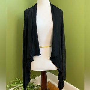 Danier leather wrap with leather sleeves.